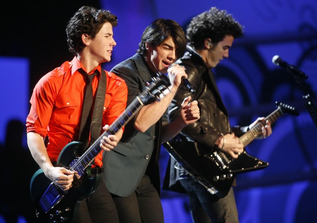 Nick Jonas, left, Joe Jonas, center, and Kevin Jonas, right, perform during the We Are The Future Concert, Monday, Jan.19, 2009, at the Verizon Center in Washington, D.C.  (Gabriel B. Tait/MCT)
