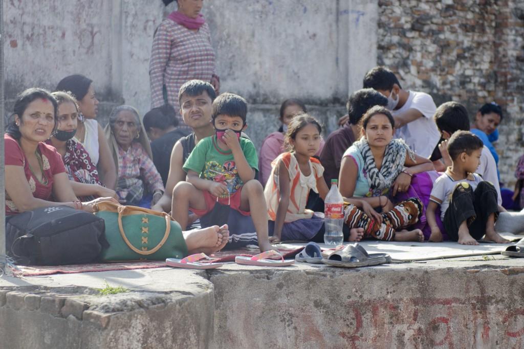 People started rushing into an open ground after a fresh 7.3-magnitude earthquake struck Kathmandu, Nepal on Tuesday, May 12, 2015. At least 42 people have been killed and 1,006 injured in the Himalayan country and neighboring states, as many buildings already weakened by a much bigger quake last month were brought down. The earthquake was centered 68 kilometers (42 miles) west of the town of Namche Bazaar, close to Mount Everest and the border with Tibet, the U.S. Geological Survey said. It could be felt as far away as northern India and Bangladesh. (Sumit Shrestha/Zuma Press/TNS)