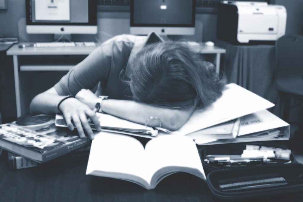 Photo simulation depicts student finding it difficult to manage a full school schedule after sleeping-in late all summer long. Despite managing rigorous schedules, there are ways to make time for sleep. Photo by Brigitte Northland.