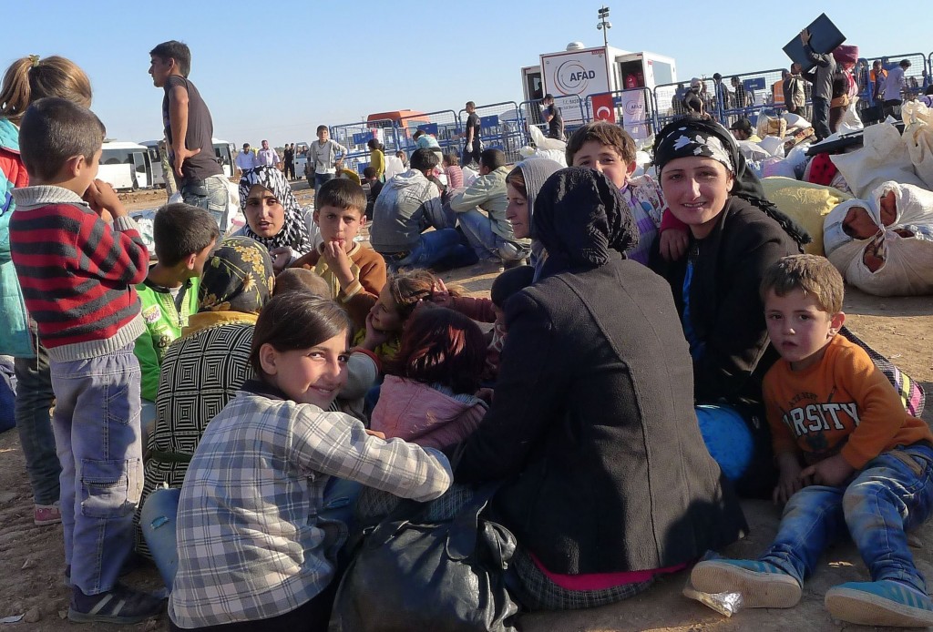 Kurdish refugees arrive in Yumurtalik, Turkey, fleeing the advances of Islamic State extremists on the north Syrian city of Kobani, on Tuesday, Sept. 30, 2014. (Roy Gutman/MCT)