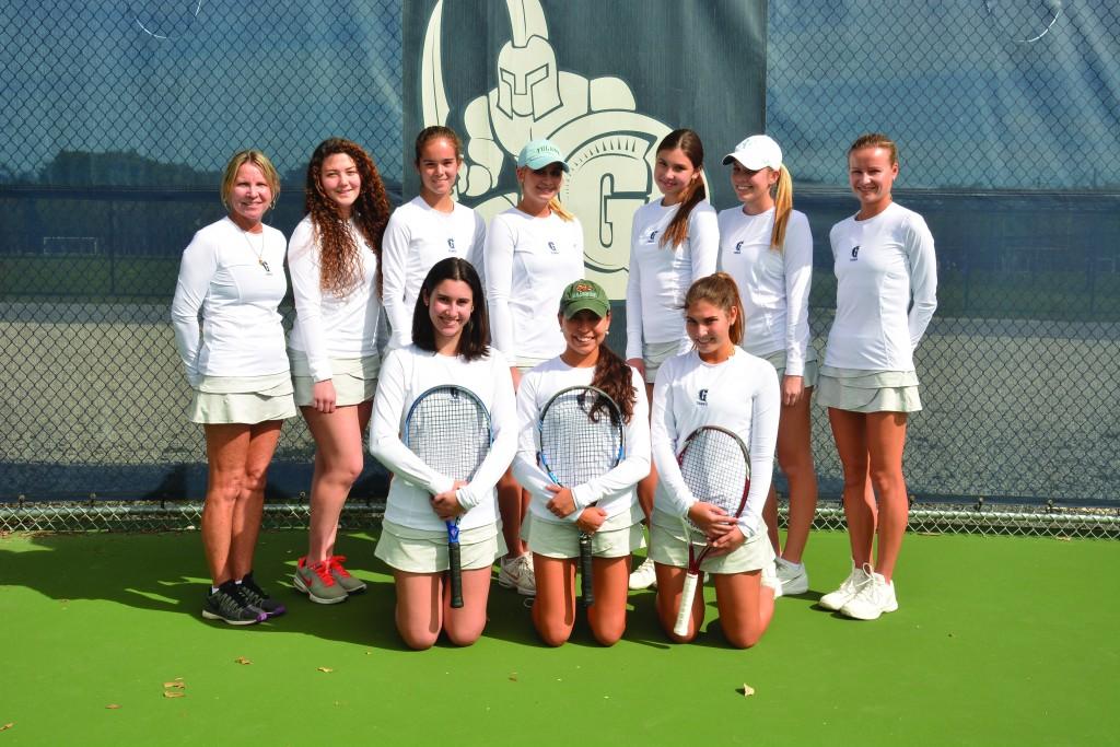 The girls’ tennis team poses for a photo. The team’s top performers are seniors  Julieta Dalmau and Estefania Navarro, along with and junior Lindy Lyons.
