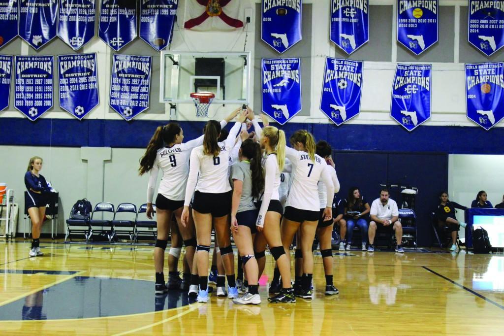 The girls volleyball team huddles up during one of their games. They currently have an 10-3 record, showing their early dominance. Key wins have come against Carrollton and Doral. Photo by Shannon Kunkel.