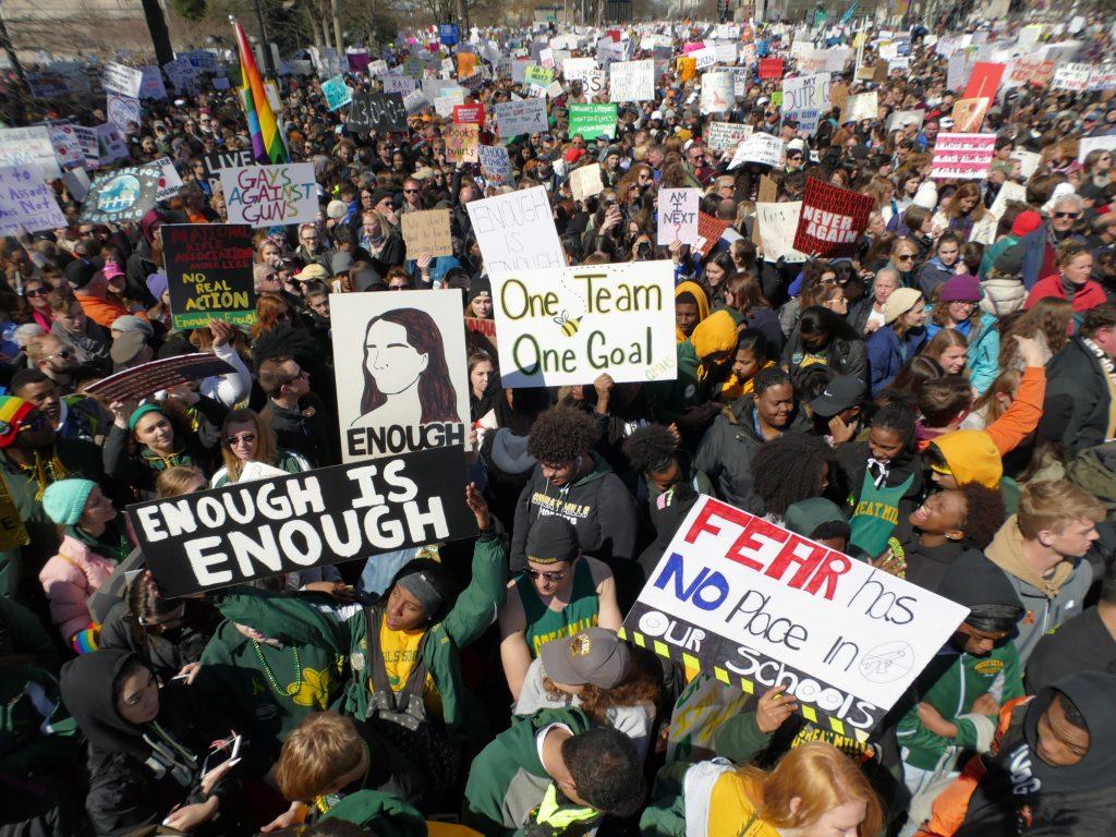 One poster depicts the slain Great Mills, Md., High School student, center, as the  group of students, with alumni and parents, attend the March For Our Lives rally to demand stricter gun control laws on Saturday, March 24, 2018, in Washington, D.C. (Karl Merton Ferron/Baltimore Sun/TNS)