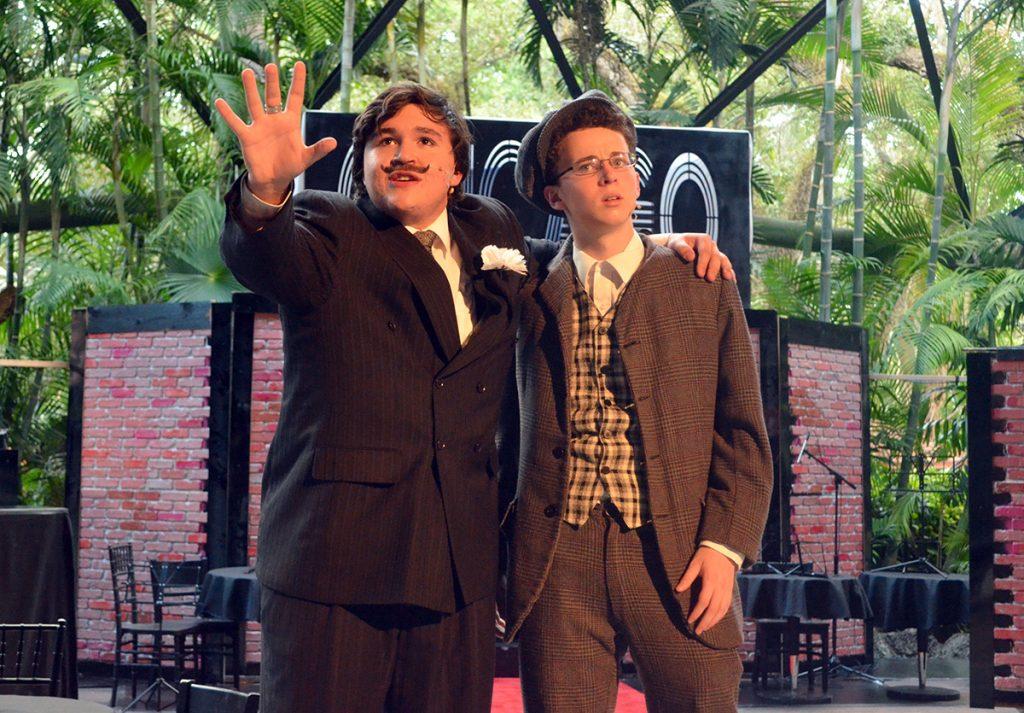 Junior Raul Mederos and freshman Edward Bannon rehearse at Pinecrest  Gardens for the drama fall play Chicago. Photo by Laura Attarian.