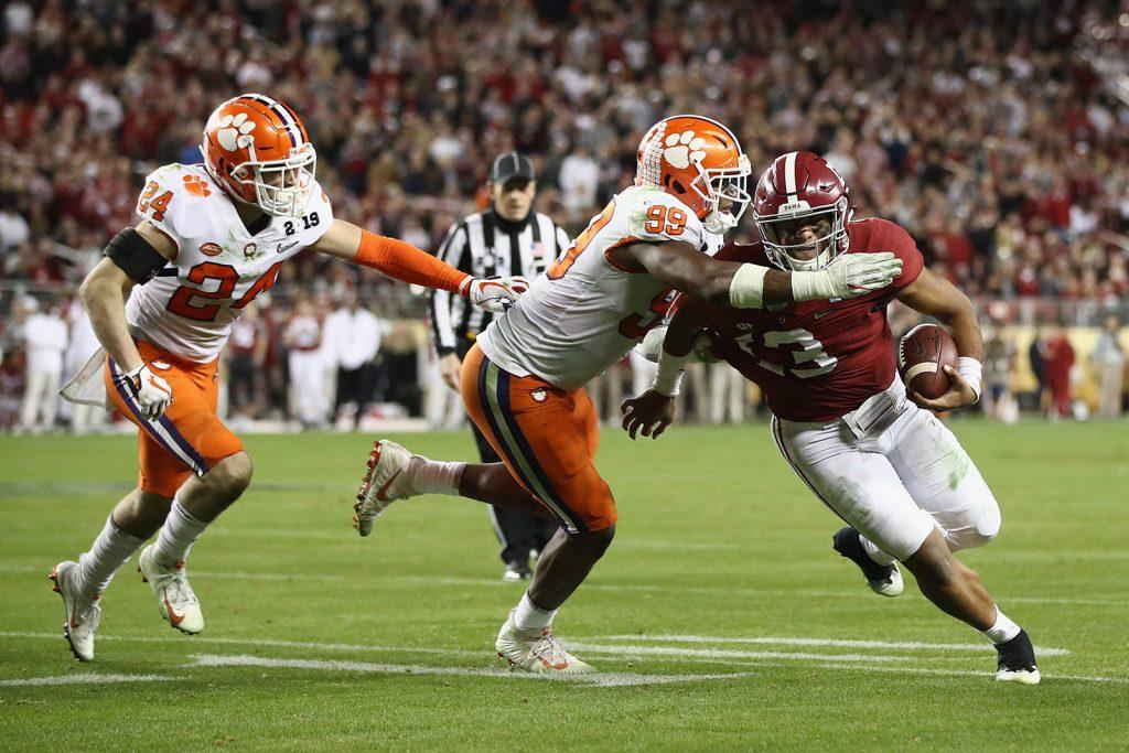 Tua Tagovailoa (13) of the Alabama Crimson Tide is tackled by Clelin Ferrell #99 of the Clemson Tigers in the CFP National Championship Monday, Jan. 7, 2019 in Santa Clara, Calif. (Ezra Shaw/Getty Images/TNS)