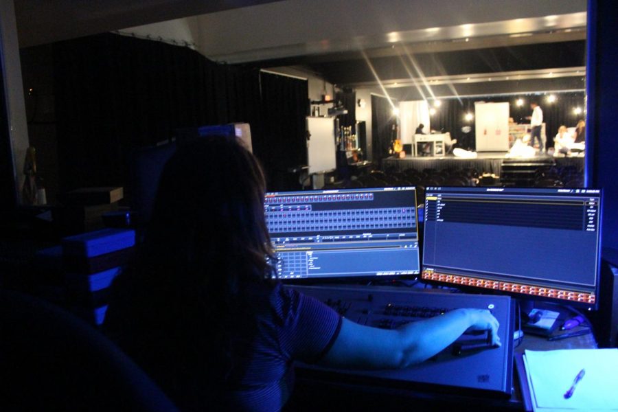 A student from the intermediate drama class works on light and sound production during the dress rehearsal for Brainstorm. The play debuted on Jan. 26, and was the first play performed by the intermediate class. Photo by Lara Russell-Lasalandra