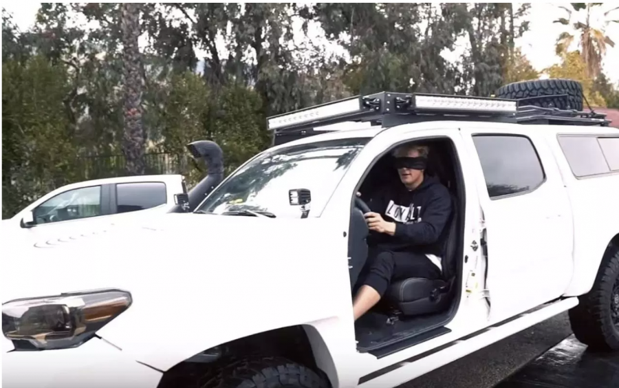 YouTube changes their policy after Jake Paul and others upload videos of the hazardous Bird Box Challenge. Participants of this challenge completed everyday tasks without their sight. Paul executed this challenge by driving his car  while blindfolded. Screenshot from Jake Paul on YouTube.  