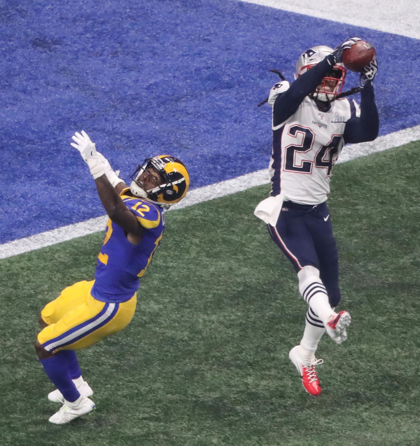 New England Patriots wide receiver Julian Edelman and Tom Brady celebrate  after the game against the Los Angeles Rams at Super Bowl LIII at  Mercedes-Benz Stadium on February 3, 2019 in Atlanta.