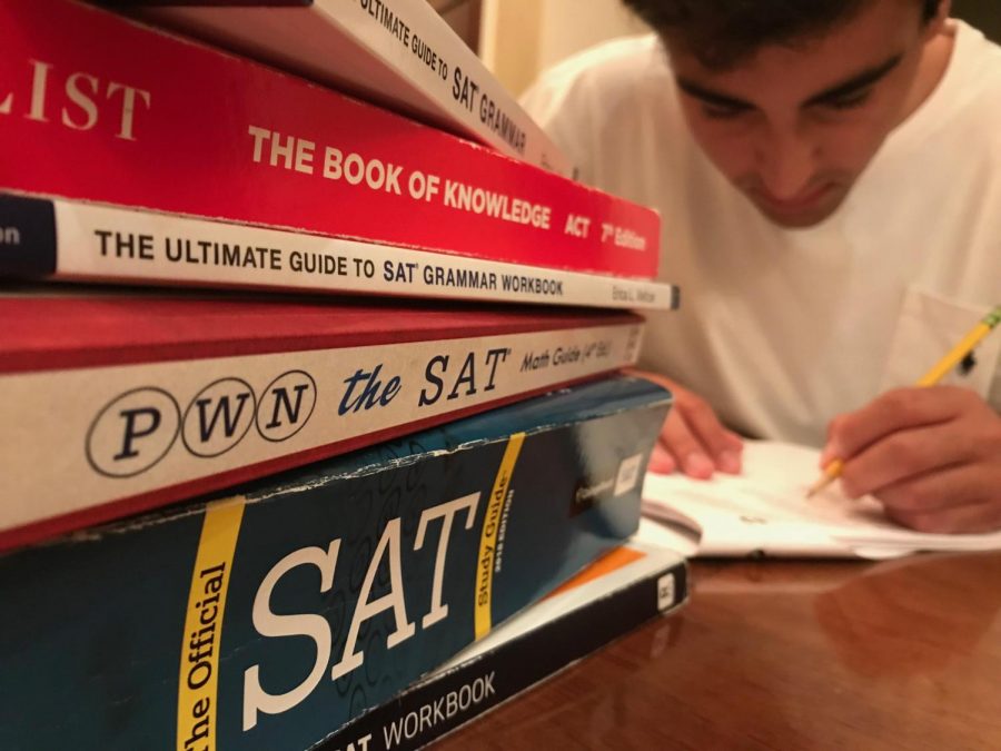 Senior Eduardo Briceño-Saez studies for his upcoming ACT. Although some schools are test-optional, many students feel they must send in their scores to be seriously considered. Photo by Lara Russell-Lasalandra.