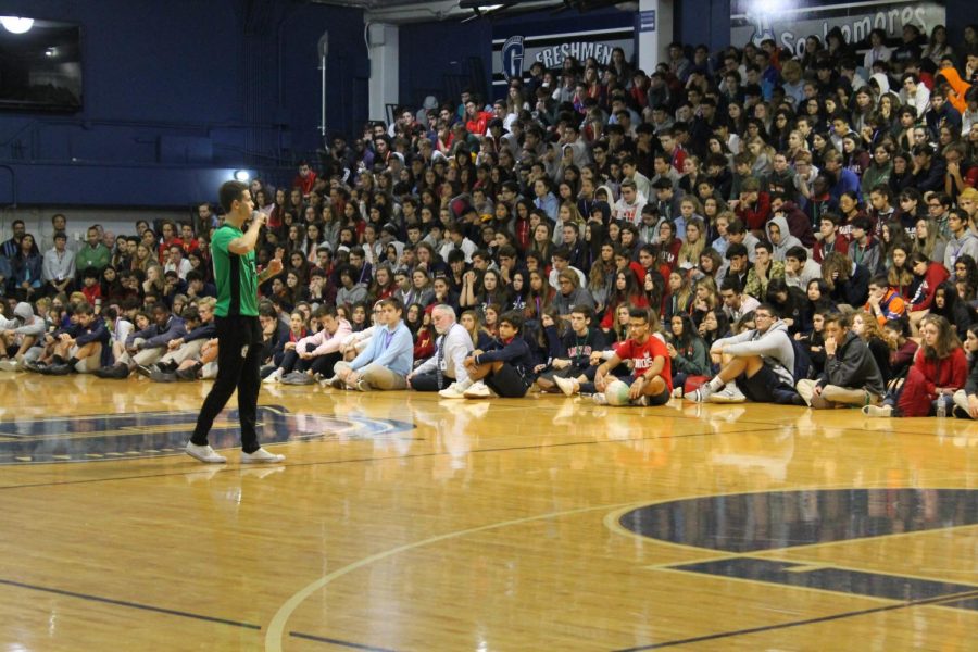 Senior and varsity soccer captain Alvaro Gonzalez Rico speaks to faculty and students during the assembly in memory of sophomore Javier Cañedo on March 6. Following the assembly, students gathered to offer each other support. Some spray painted messages on the athletic field while others wrote messages on papers set outside of the cafeteria. 