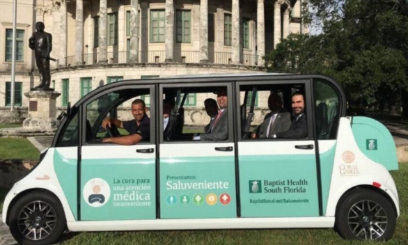 Freebee, a free ride-hailing service, makes a stop in front of Coral Gables City Hall. (Harry E. Gottlieb via Miami Herald/TNS)