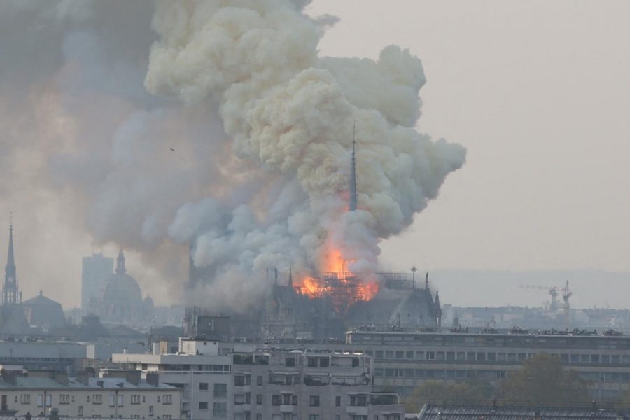 Smoke and flames rise during a fire at the landmark Notre Dame Cathedral in central Paris, France on Monday, April 15, 2019, potentially involving renovation works being carried out at the site, the fire service said. (Jerome Domine/Abaca Press/TNS)