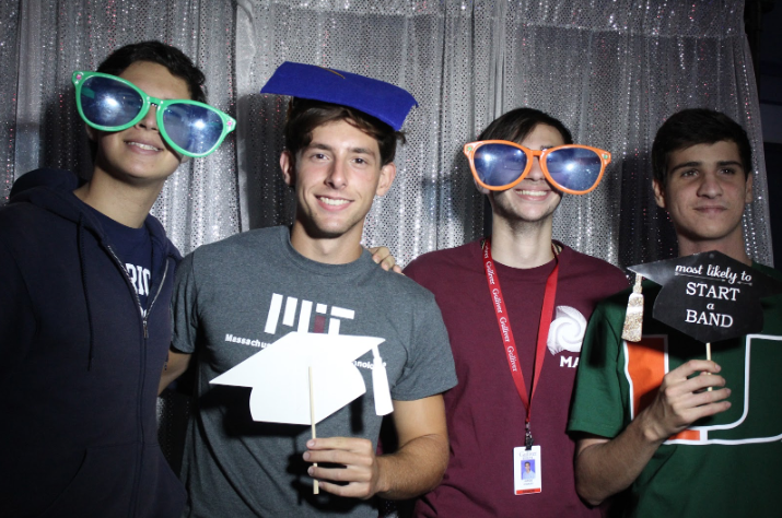 Left to right: Seniors Zain Bataineh, Robert Cancio, Jorge Gonzalez, and Chris Ricardo pose in the photo booth at The Blue Dungeon during senior sendoff. Photo by Julian Concepcion.