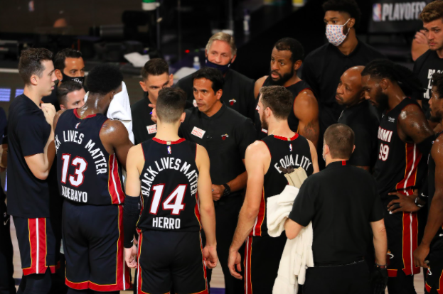 Erik Spoelstra of the Miami Heat talks with his team during the fourth quarter against the Milwaukee Bucks in Game Five of the Eastern Conference Second Round during the 2020 NBA Playoffs at The Field House at the ESPN Wide World Of Sports Complex on Tuesday, September 8, 2020 in Lake Buena Vista, Florida.