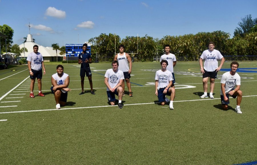 Football seniors gather for a picture during socially distant workouts. Players have to get their temperature checked and are asked a series of questions asking if they have symptoms of Covid-19 before every practice. 