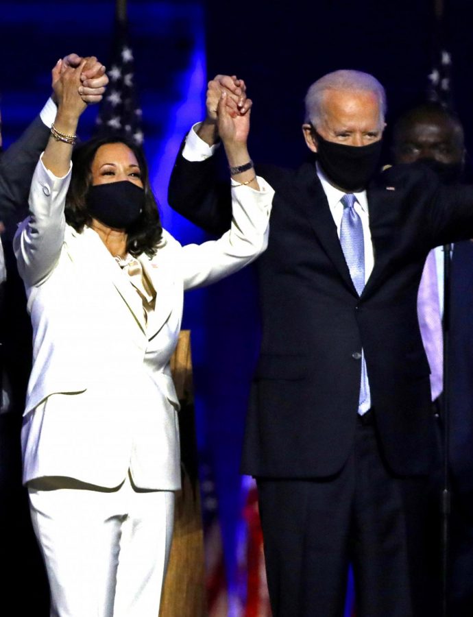 On November 7, 2020, Vice-President-elect Kamala Harris and President-elect Joe Biden celebrate with supporters after declaring victory at the Chase Center in Wilmington, Delaware.