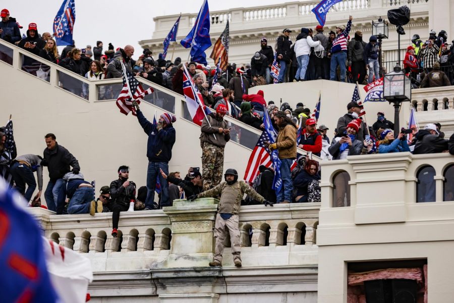 Pro-Trump supporters storm the U.S. Capitol following a rally with President Donald Trump on Wednesday, Jan. 6, 2021 in Washington, D.C. Congress held a joint session Wednesday to ratify President-elect Joe Bidens 306-232 Electoral College win over President Trump. A group of Republican senators said they would reject the Electoral College votes of several states unless Congress appointed a commission to audit the election results.