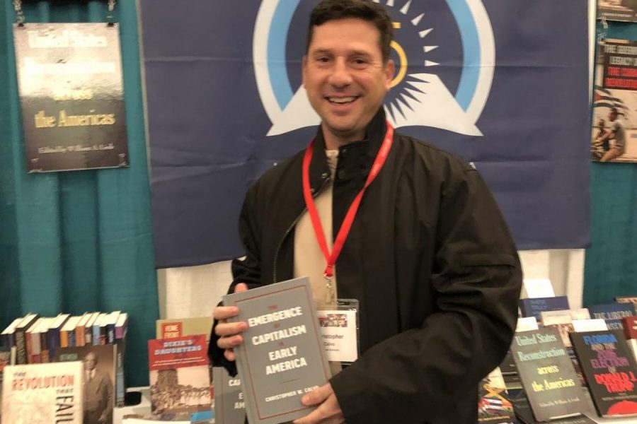 Dr. Calvo and his book, The Emergence of Capitalism in Early America, at the press table at the American Historical Association Conference in New York City in January 2020.