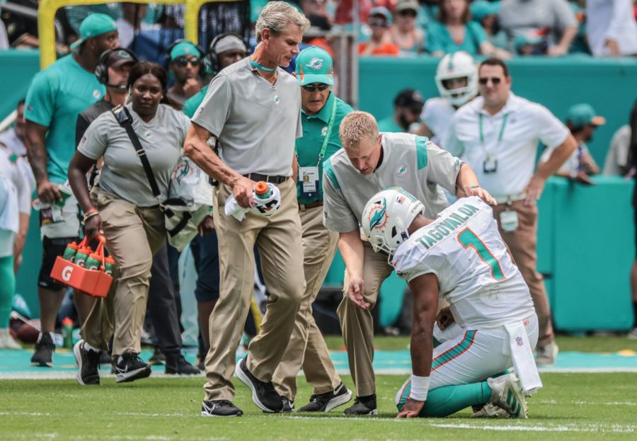 Miami Dolphins quarterback Tua Tagovailoa (1) drops to his knees after getting injured in the first quarter during a game against the Buffalo Bills in Miami Gardens on Sunday, September 19, 2021.