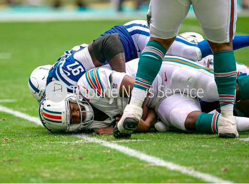 Miami Dolphins Miami Dolphins quarterback Jacoby Brissett (14) is sacked late in the first half by Indianapolis Colts defensive tackle Al-Quadin Muhammad (97) during NFL game at Hard Rock Stadium Sunday in Miami Gardens.