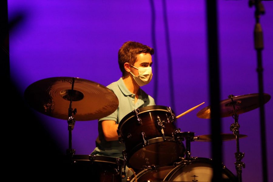 Junior Victor Giraldez plays the drums at the Uniteen Talent Show on Nov. 2. Students used the talent show as an opportunity to perform for an audience as well as benefit the Achieve Miami non-profit.