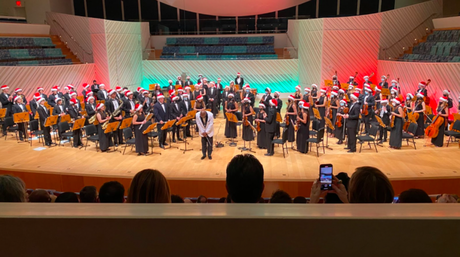 The+annual+Holiday+Concert+commences+as+conductor+and+Music+Department+Head+Rufus+Jones+bows+to+the+audience.+
