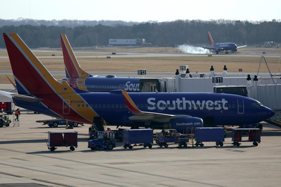 The+Southwest+Airlines+check-in+counter+at+BWI+Thurgood+Marshall+Airport+is+seen+busy+by+pre-dawn+Sunday+morning+on+January+2%2C+2022%2C+as+many+holiday+travelers+headed+home.