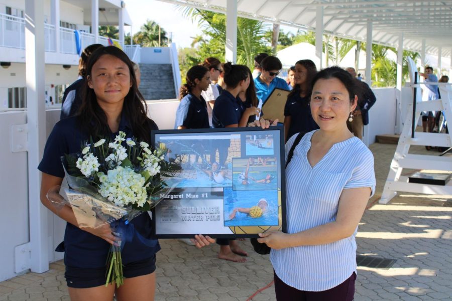 Senior Margaret Miao poses with her mother after the girls water polo Senior Day ceremony.
