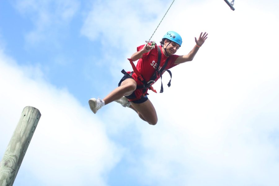 Senior Sam Cano attempts the trapeze at the senior field trip.
