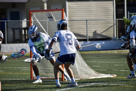 Sophomore Dominic Veloso makes a save against Westminster on Mar. 29.