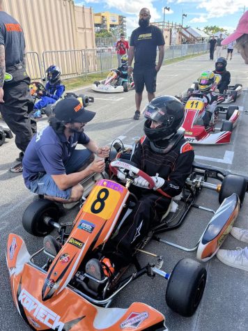 Junior Leo Suess, in addition to being a member of the school sailing team, competes in go-kart races at the Homestead Speedway.