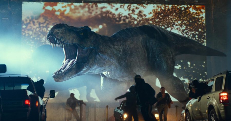 A Tyrannosaurus rex crashes a drive-in movie experience in the new film Jurassic World Dominion. (Universal Pictures/Amblin Entertainment/TNS)