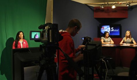Chelsea Duchene, from left, waits to present the weather as Jake Wingo records anchors Krystal Jones and Olivia Heacock, all juniors and 16 at Truman High School in Independence, Missouri, during the KTSN Channel 15 news, October 19, 2010. Even though professional jobs are disappearing in the newspaper industry, interest in journalism is still high among young people.