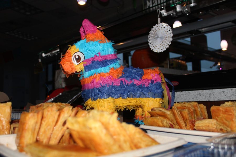 FESTIVE FOODS: Pastelitos are laid out on a table along with fun decorations. Attendees could take a break from learning salsa to enjoy a variety of hispanic snacks including pastelitos, tequeños, and croquetas.