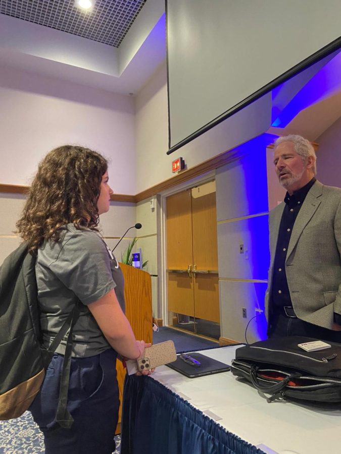 Digital Mass Media student and Copy Editor for The Raider Voice, Sara Gelrud, asks Pulitzer Prize winning journalist Rick Hirsch questions after his Journalism in 2022: More Essential Than Ever workshop