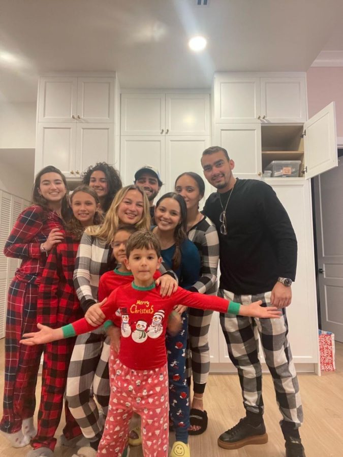 Mia Carrasco takes a festive picture with her family while on winter break.