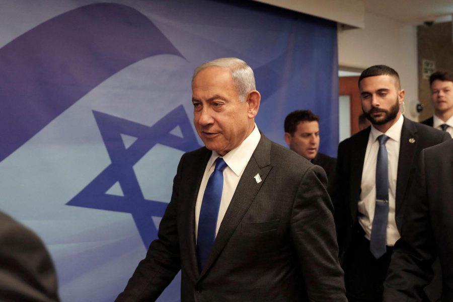 Israeli Prime Minister Benjamin Netanyahu, left, arrives for the weekly cabinet meeting in Jerusalem on Tuesday, Jan. 3, 2023.

