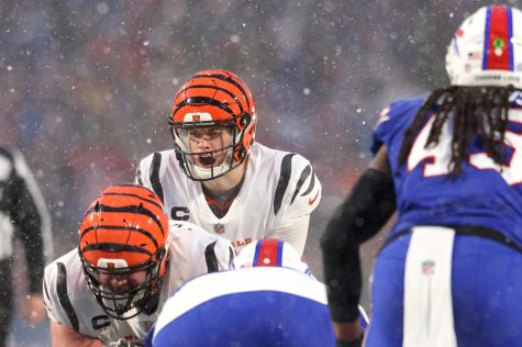 Joe Burrow (9) of the Cincinnati Bengals calls a play against the Buffalo Bills during the third quarter in the AFC Divisional Playoff game at Highmark Stadium on Jan. 22, 2023, in Orchard Park, New York.