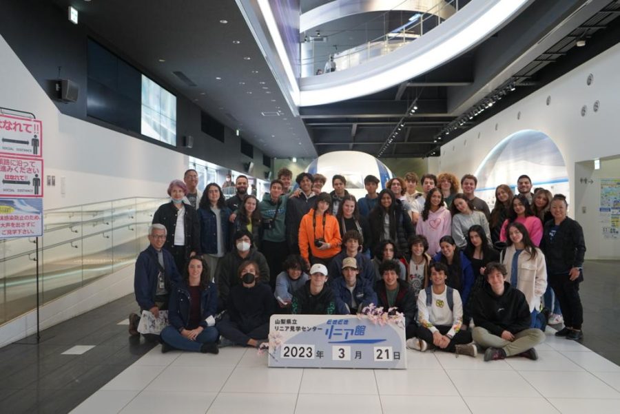 The tour group stops for a picture while touring the Yamanashi Prefectural Maglev Exhibition Center, where an experimental maglev train passes every ten minutes at up to 500 kph.
