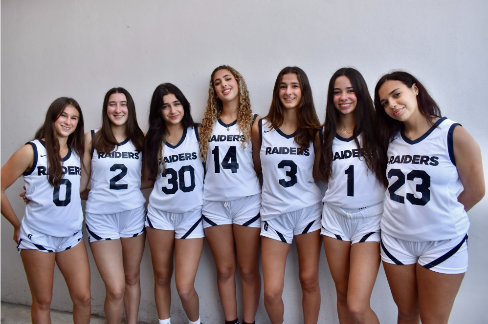 Team seniors gather to take pictures on media day. With arms interlocked, they bunched together trying to contain themselves from laughing. “Last one girls, 3, 2, 1 smile,” said photographer Jen Uccelli. 