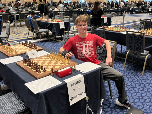 Gold sits in front of a chess board at the National High School Chess Championship last December. Gold began playing chess in seventh grade. Along with chess, Gold has a passion for cooking and both hobbies complement each other nicely.
