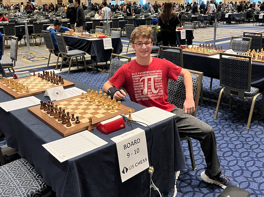 Gold sits in front of a chess board at the National High School Chess Championship last December. Gold began playing chess in seventh grade. Along with chess, Gold has a passion for cooking and both hobbies complement each other nicely.