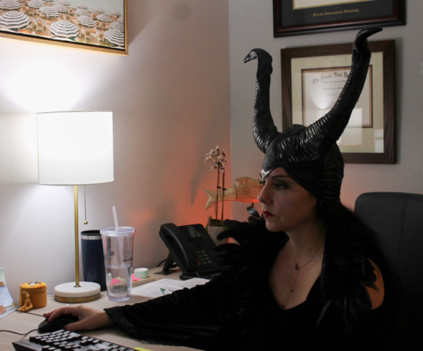 Guidance Counselor Renee McEachern works in her office, dressed up as Maleficent. Her costume followed a department-wide theme centered around Disney villains. The guidance counselors proudly displayed their costumes when they gathered outside during first break. 