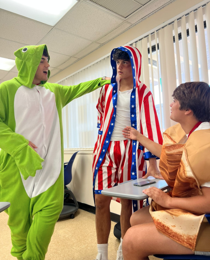Seniors (left to right) Dominic Veloso, David Rincon, and Cosme Salas appreciate one anothers costumes. Just like other students, they dressed up in celebration for Halloween. My favorite holiday is Halloween because I love showing the all the funky costumes I have in my wardrobe to my friends, Veloso said.