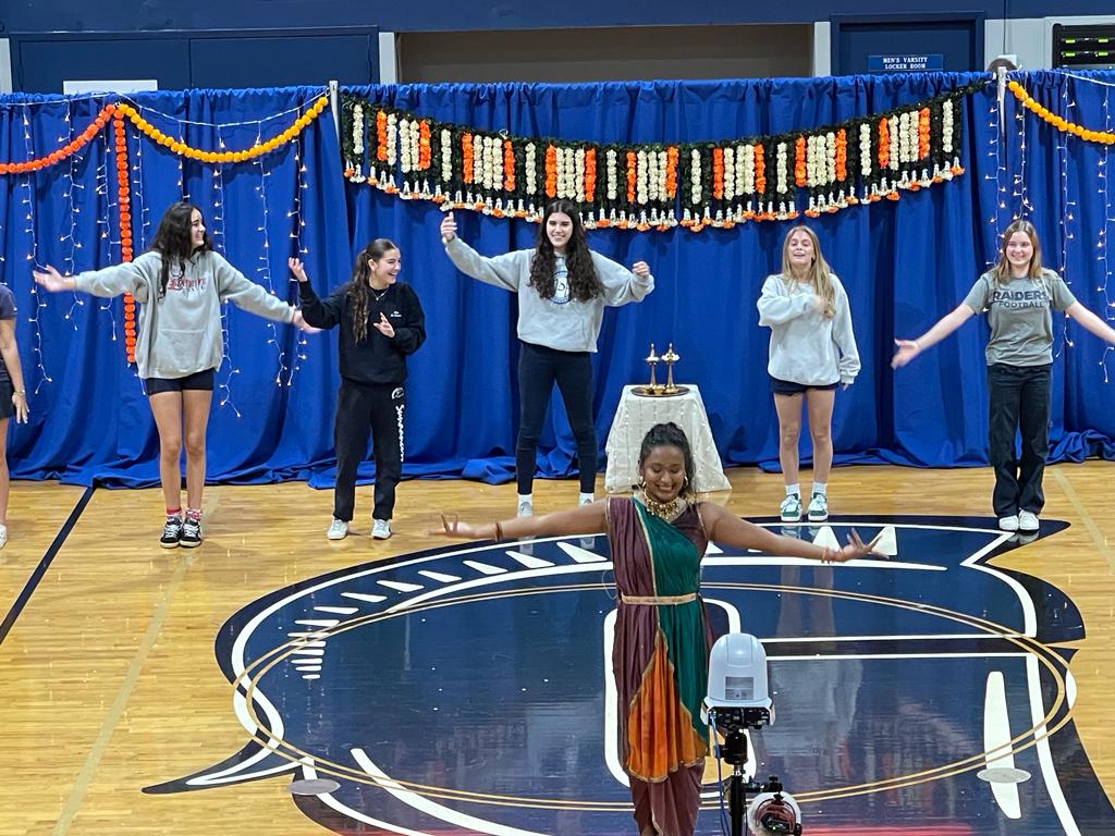 Madhavi Narayanan teaches the dance team traditional Diwali dance moves. The Junior Sundancers had a blast on stage while learning new dances. All of them danced together as their peers cheered them on.