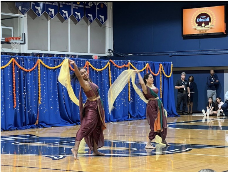 BollyPop instructors Madhavi Narayanan and Nivedita Mahesh showcase their performance in the gymnasium in celebration of Diwali — the Hindu festival of lights. Both danced to traditional Indian songs as students and faculty cheered them on. Their distinctly-styled choreography stole the show at the Upper School Campus.