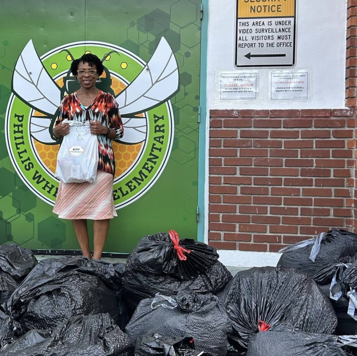 Social+Justice+Warriors+%28SJW%29+delivered+400+bags+of+food+to+Phillis+Wheatley+Elementary.+The+club+continues+to+do+these+initiatives+year+after+year+to+provide+a+helping+hand+to+those+in+need.+It+comforts+me+knowing+I+am+giving+back+to+my+community+as+best+I+can%2C+junior+SJW+member+Daniel+Wood+said.