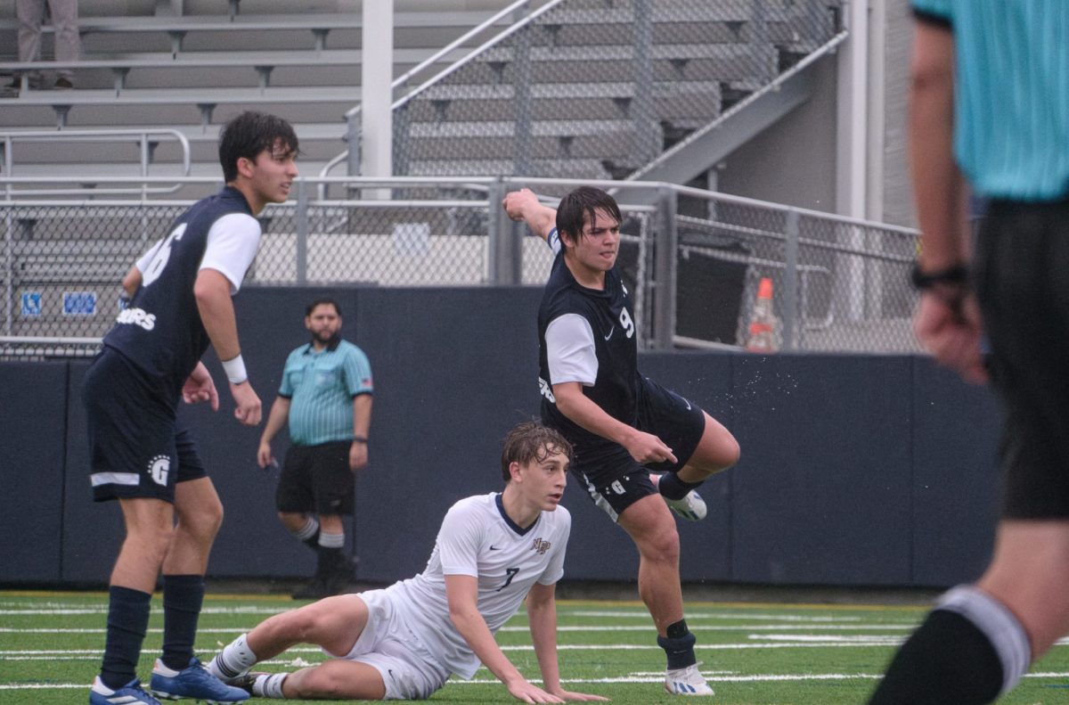 Senior and captain Cosme Salas kicks the ball into the goal. He scored and help the team win. They team scored three goals and won the Palm League Championship. 