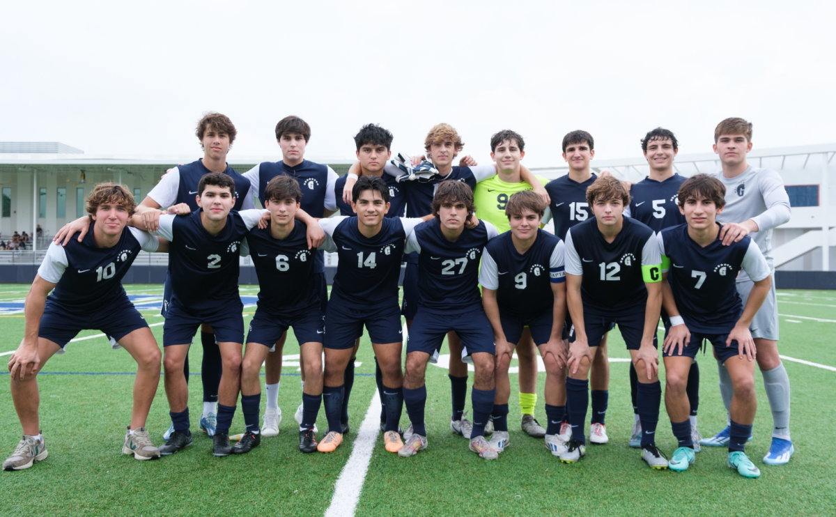 The+seniors+on+the+boys+varsity+soccer+team+pose+for+a+photo.+They+celebrated+senior+day+at+their+last+game.+They+each+received+a+plaque+and+celebrated+with+their+families.+