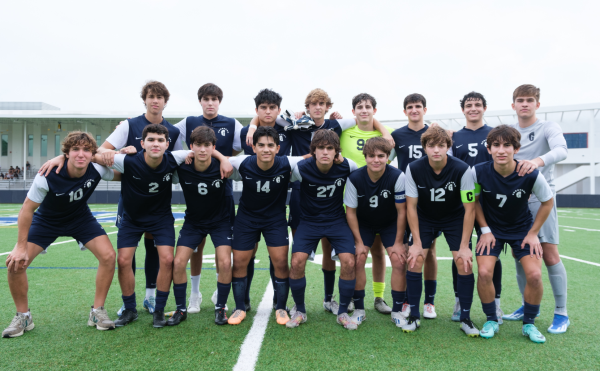 The seniors on the boys varsity soccer team pose for a photo. They celebrated senior day at their last game. They each received a plaque and celebrated with their families. 